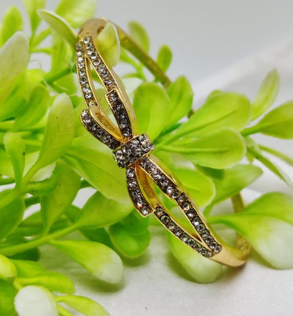 Imported adjustable bow bracelet with dazzling crystals and elegant design