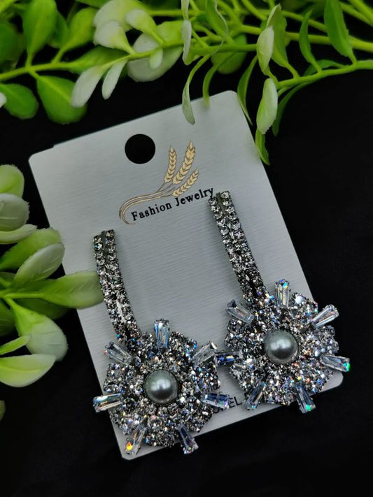 Starburst earrings with crystal design and pearl drop