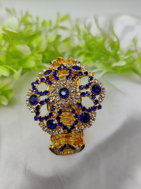 Royal blue sapphire bracelet with golden accents and adjustable strap