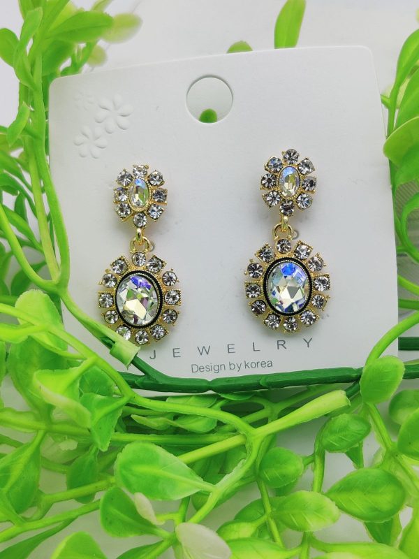 Elegant crystal-embedded dangling earrings with sparkling stones – perfect for formal or casual wear