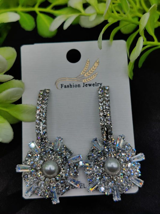 Starburst earrings with crystal design and pearl drop