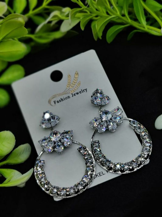 Floral hoop earrings with flower accents and shiny circular design