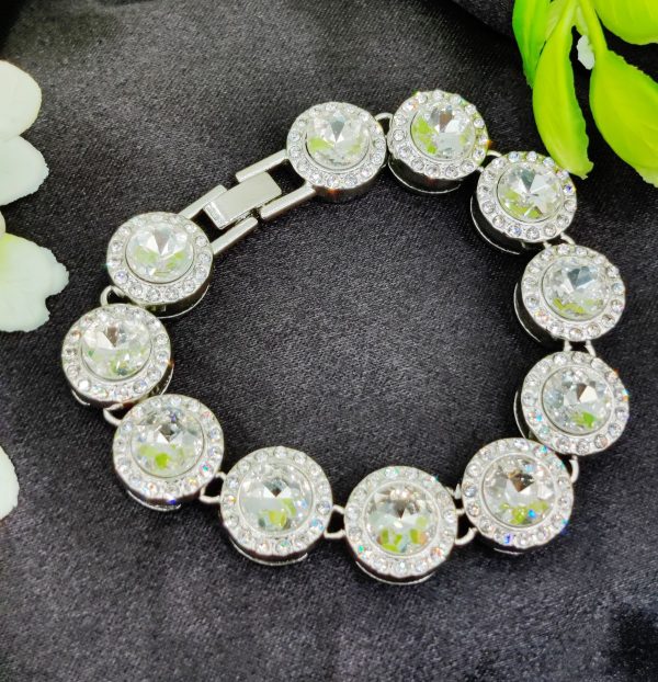 Imported adjustable bracelet with silver accents and shining crystals
